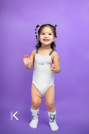 Kult Logo Strap Baby Bodysuit with Resistain® in Salt